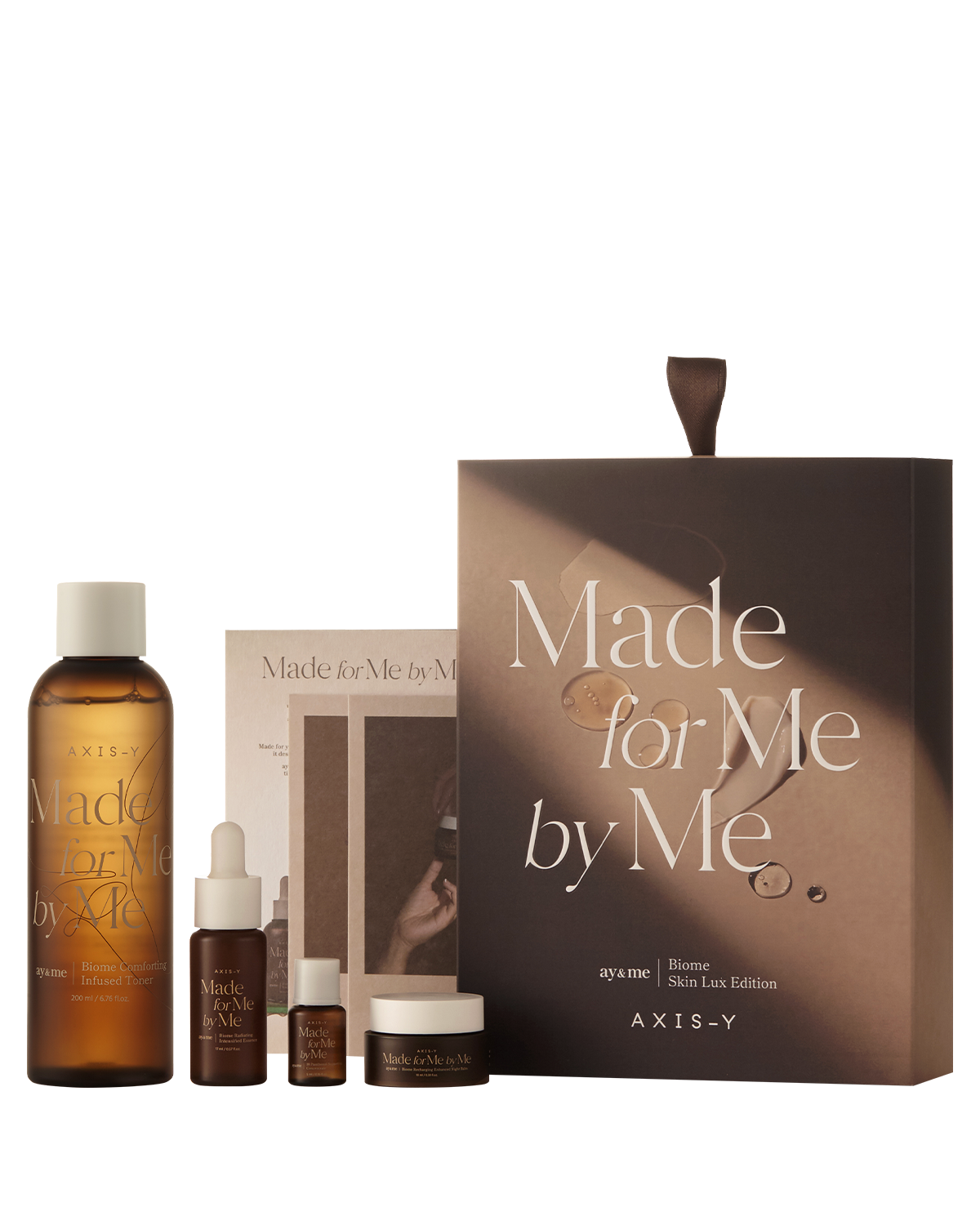 AXIS-Y Biome Skin Lux Edition skincare set including toner, essence, night balm, and concentrate.