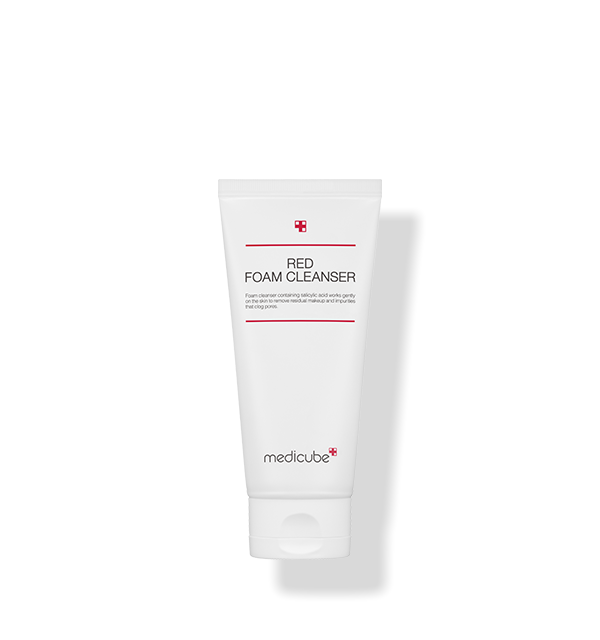 Medicube Red Foam Cleanser bottle surrounded by foam, representing foaming texture for deep cleansing