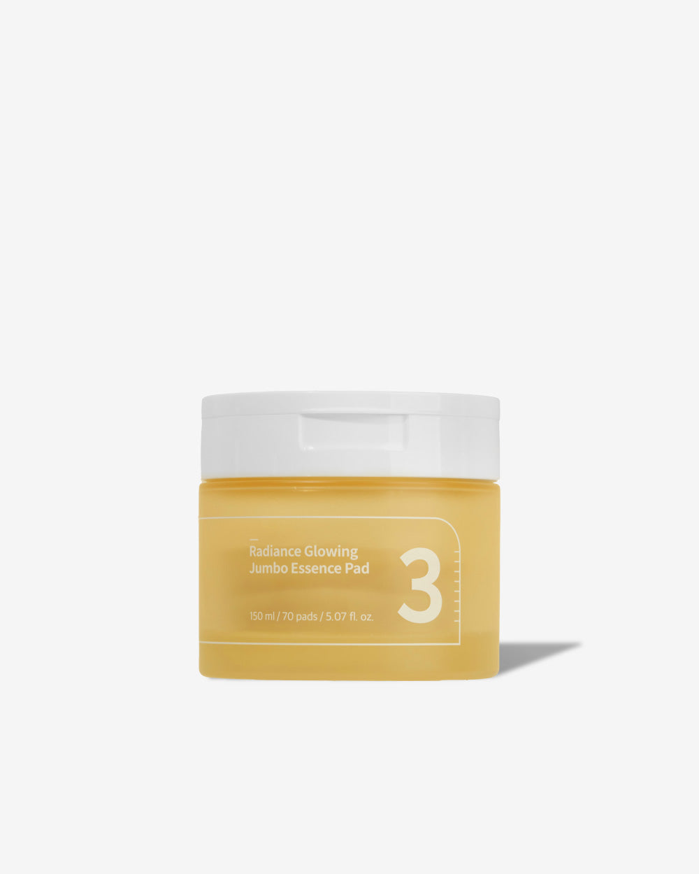 Jar of Numbuzin No.3 Radiance Glowing Jumbo Essence Pads with one pad lifted, soaked in milky essence